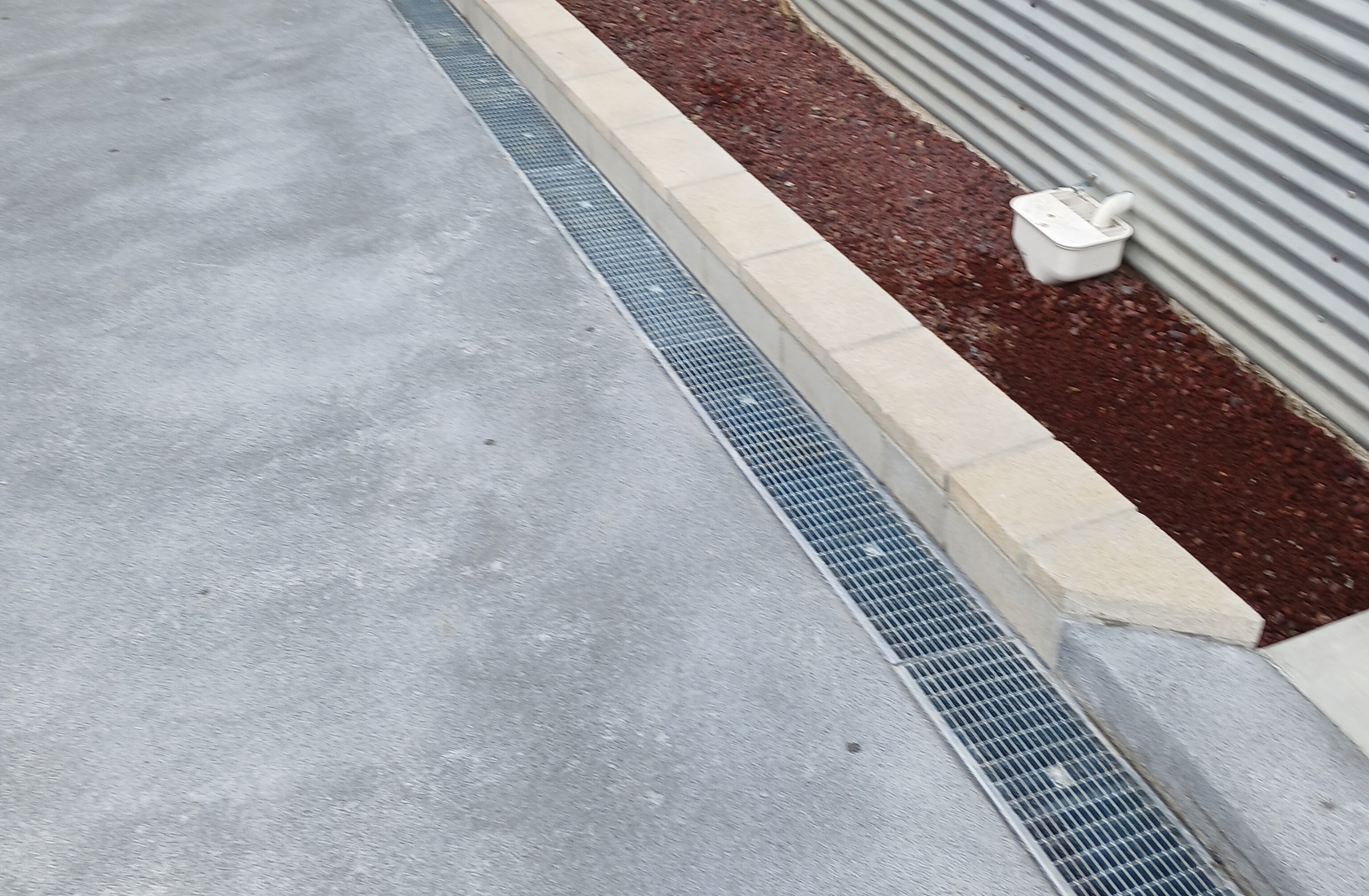Residential Hero Driveway drainage channel installed to direct rainwater away from paved areas.