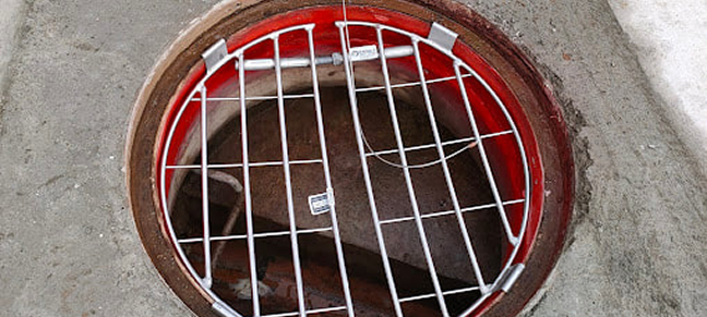 Sewer pipe installation in a freshly excavated trench as part of drainage and wastewater infrastructure work.