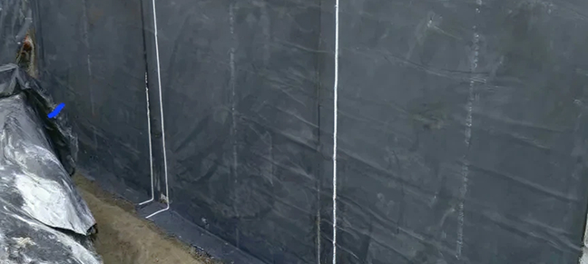 Protective waterproof layer used to prevent moisture penetration in drainage areas.