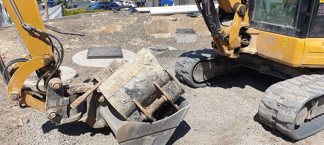 Digger doing work on an  building site.